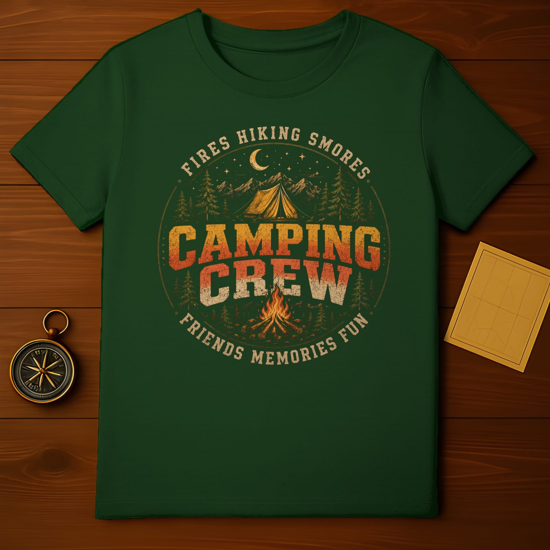 Green t-shirt with vintage "Camping Crew" graphic featuring tent, campfire, and forest.
