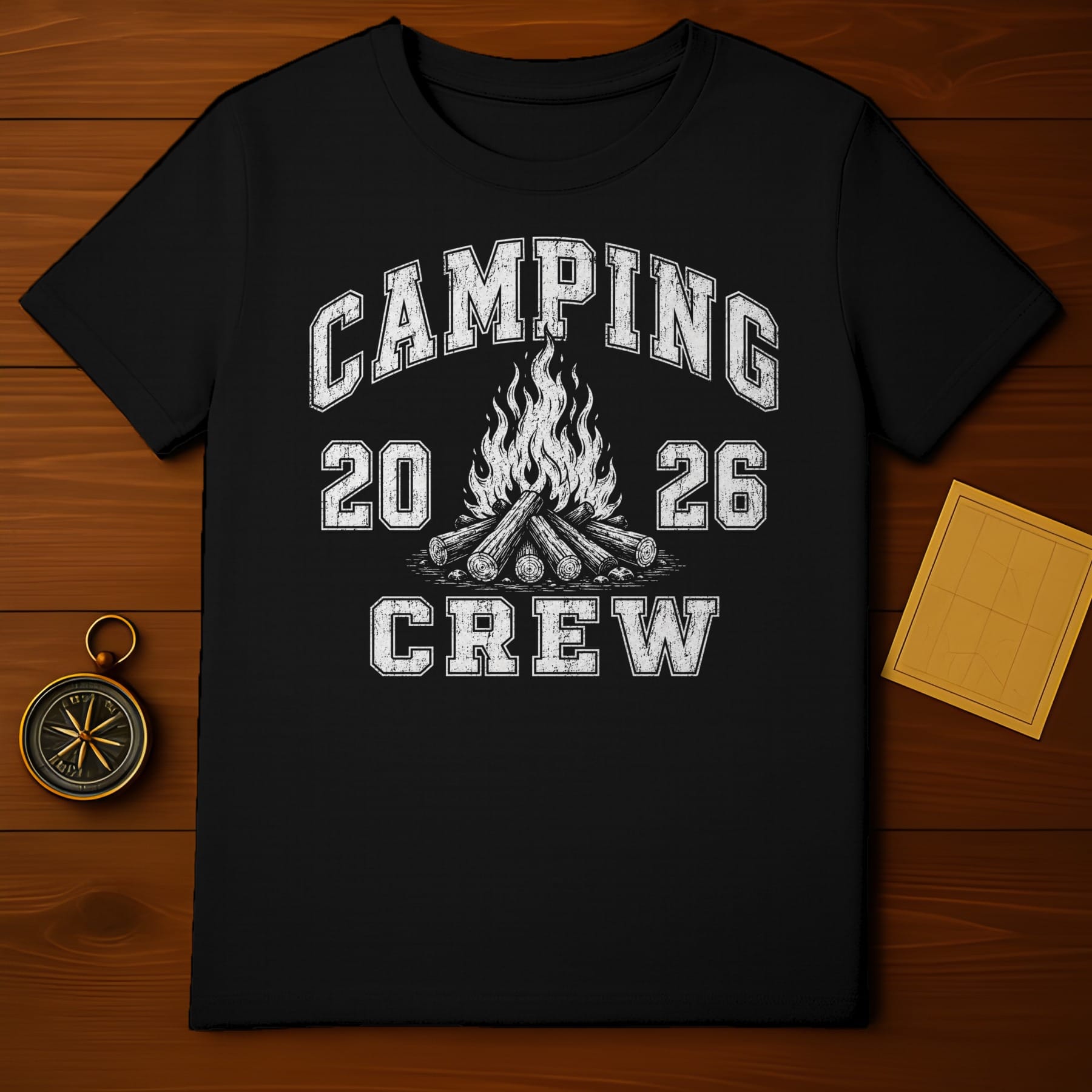 Black t-shirt with "Camping 20 26 Crew" text and campfire graphic.