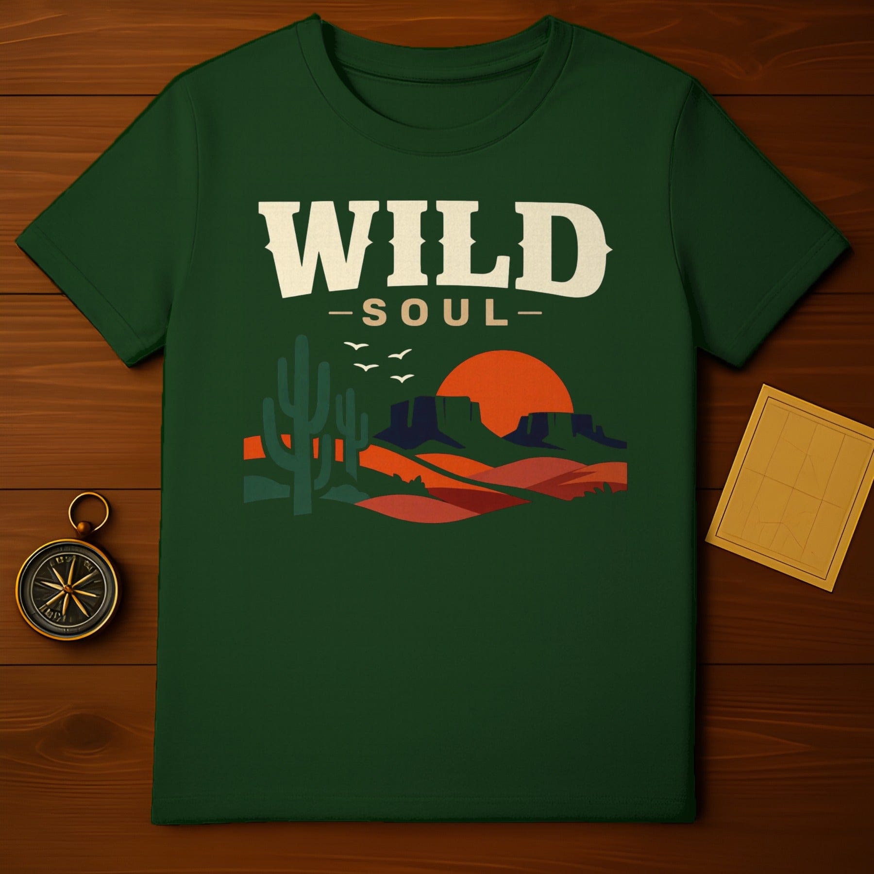 WILD SOUL Desert Landscape Sunset Cacti Birds Green product type
wild soul
desert landscape
sunset graphic
cacti design
mountain view
birds flying
nature inspired
green apparel
adventure theme
outdoor style
bohemian spirit
western aesthetic
road trip
arizona scene
wanderlust
forest green
graphic print
unique design
retro style
outdoors explorer