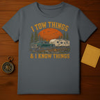 Gray t-shirt with distressed graphic of truck, camper, and text "I tow things & I know things".