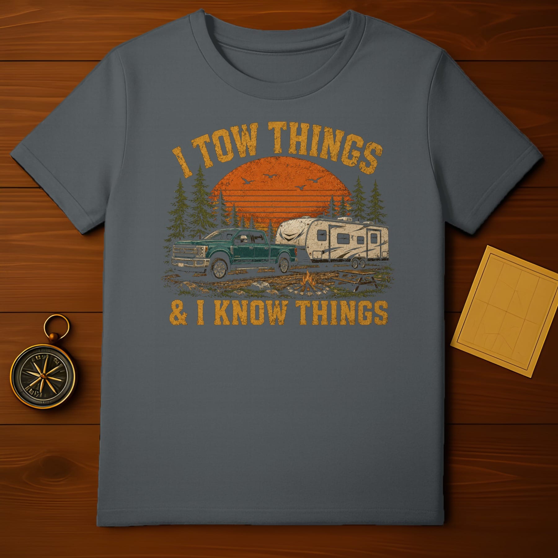 Gray t-shirt with distressed graphic of truck, camper, and text "I tow things & I know things".