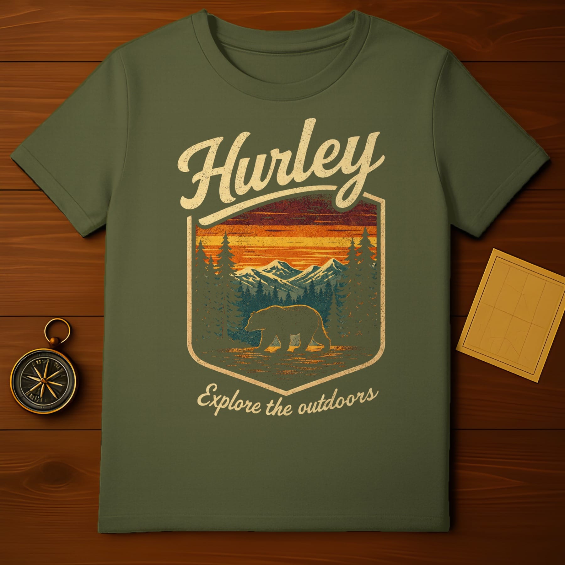 Olive green Hurley t-shirt with bear and mountain landscape graphic.