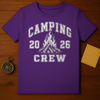 Purple t-shirt with "CAMPING 20 26 CREW" text and campfire graphic.