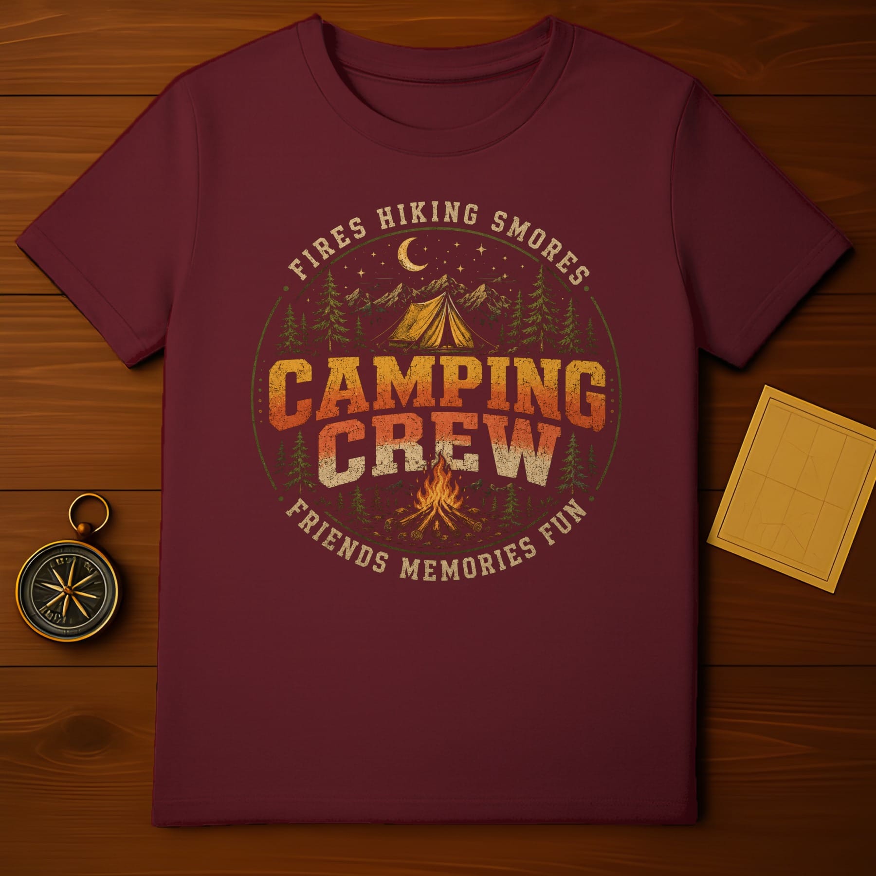 Maroon t-shirt with "Camping Crew" graphic featuring campfire, tent, and mountains.