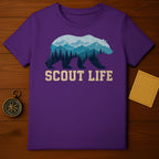 Purple t-shirt with a bear silhouette filled with mountains, trees, and text "SCOUT LIFE".