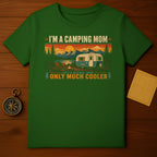 Green t-shirt with "I'm A Camping Mom Like A Normal Mom Only Much Cooler" text and mountain landscape.