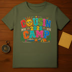 Green t-shirt with "Cousin Camp 2026" text and camping scene.