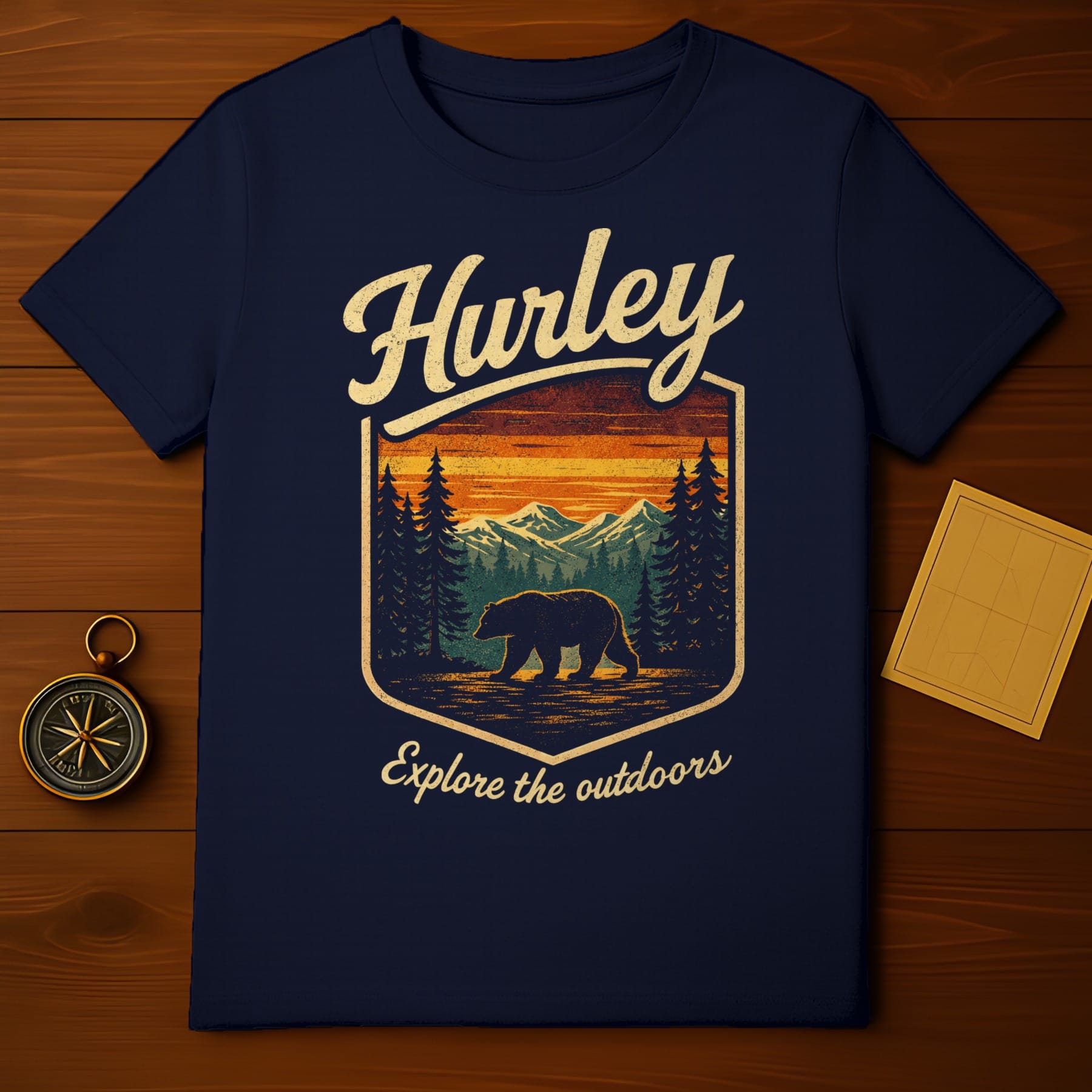 Navy t-shirt with "Hurley Explore the outdoors" and bear in forest graphic.