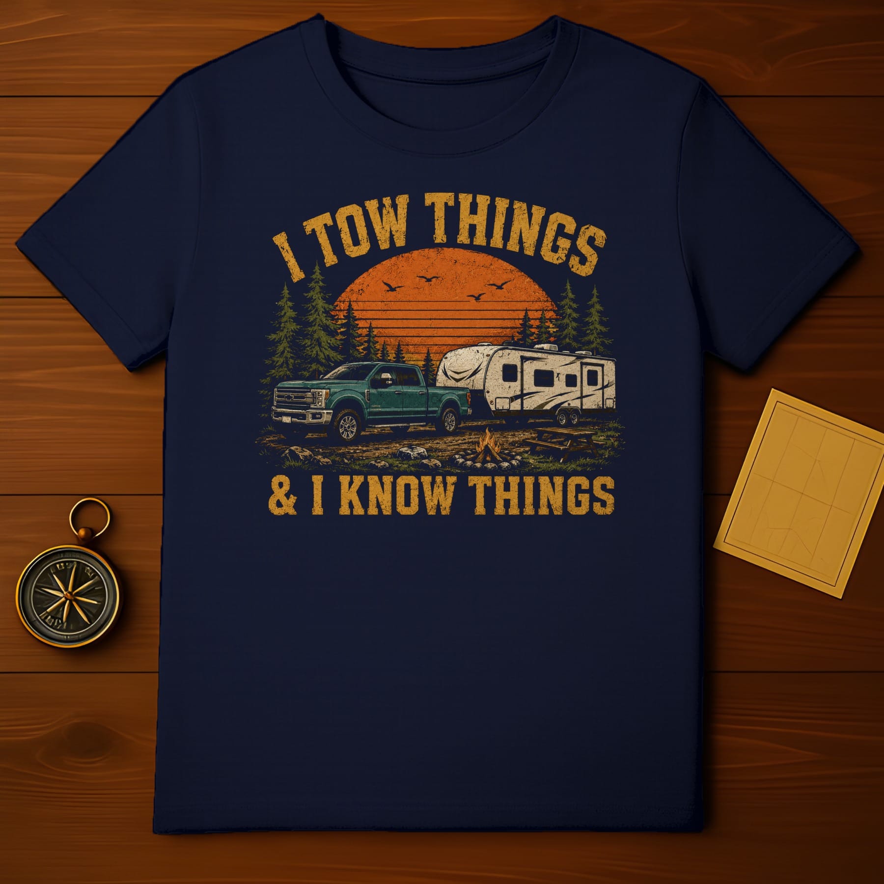 T-shirt with "I TOW THINGS & I KNOW THINGS" text and camper scene.