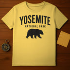 Yellow t-shirt with black Yosemite National Park bear silhouette logo.