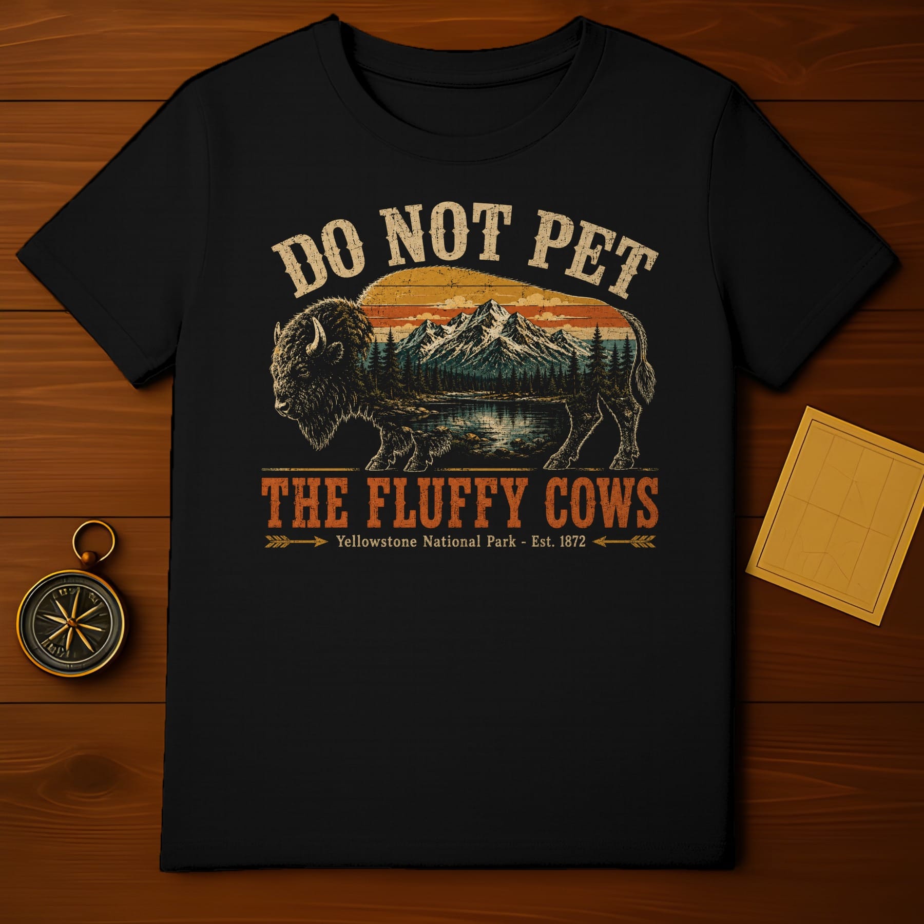 Black t-shirt with buffalo, mountains, forest, and text "Do Not Pet The Fluffy Cows".