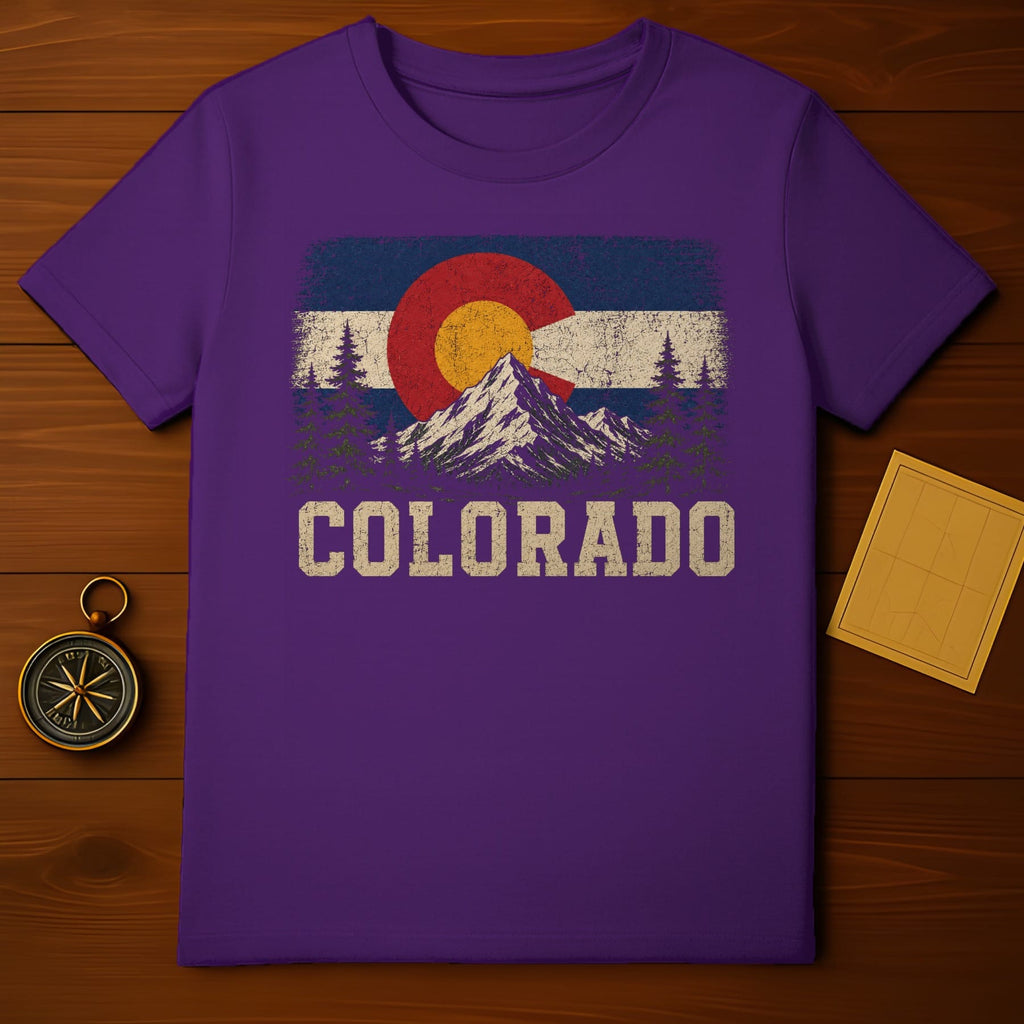 Purple t-shirt with vintage Colorado flag graphic and mountain landscape.