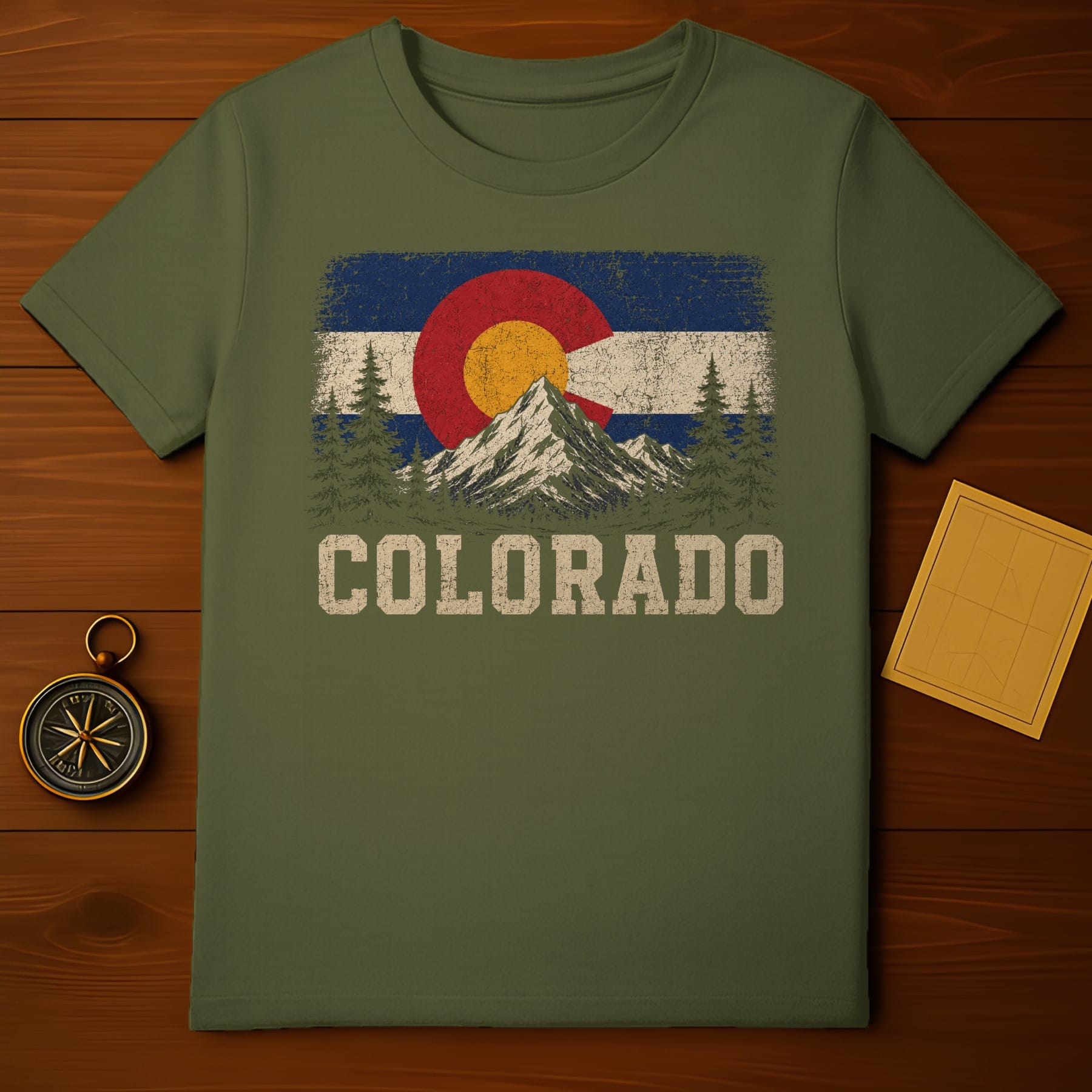 T-shirt with distressed Colorado flag, mountains, trees, and text.