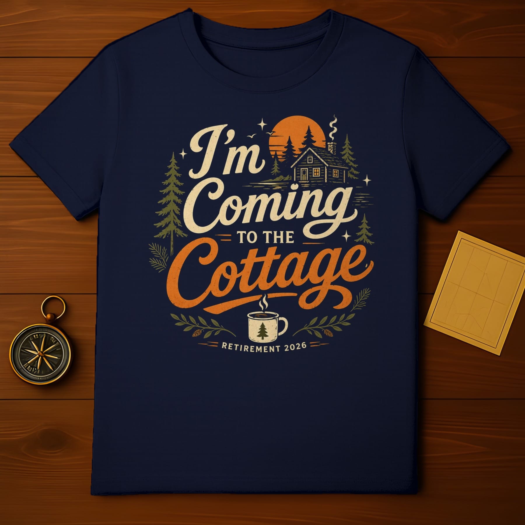 Navy t-shirt with "I'm coming to the cottage" text and a cabin scene.