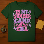 Green t-shirt with "In My Summer Camp Era" text and camping graphics.