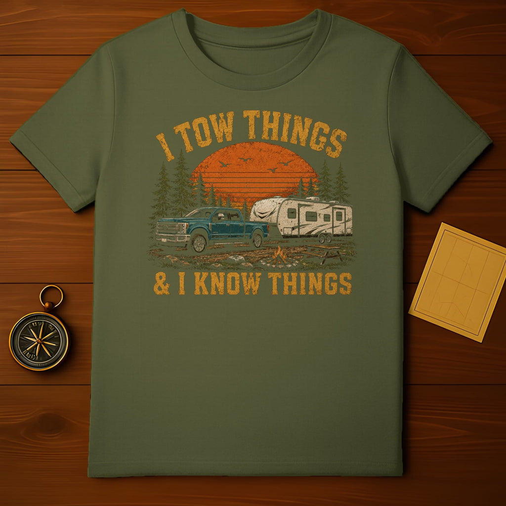 Green t-shirt with distressed graphic "I TOW THINGS & I KNOW THINGS" with truck and camper.