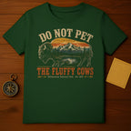 Dark green t-shirt with vintage bison graphic and text "DO NOT PET THE FLUFFY COWS Yellowstone National Park".