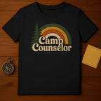 Black t-shirt with "Camp Counselor" text and retro rainbow graphic.