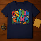 Graphic tee with "Cousin Camp 2026" text, sun, camping scene