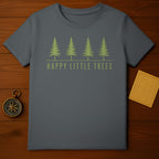 Gray t-shirt with four green pine trees and "HAPPY LITTLE TREES" text.