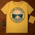 Yellow t-shirt with Lake Norman, N.C. circular logo featuring a sunset over a lake.