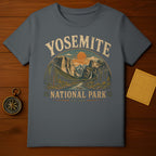 Yosemite National Park graphic on a dark grey t-shirt with vintage sunset landscape.