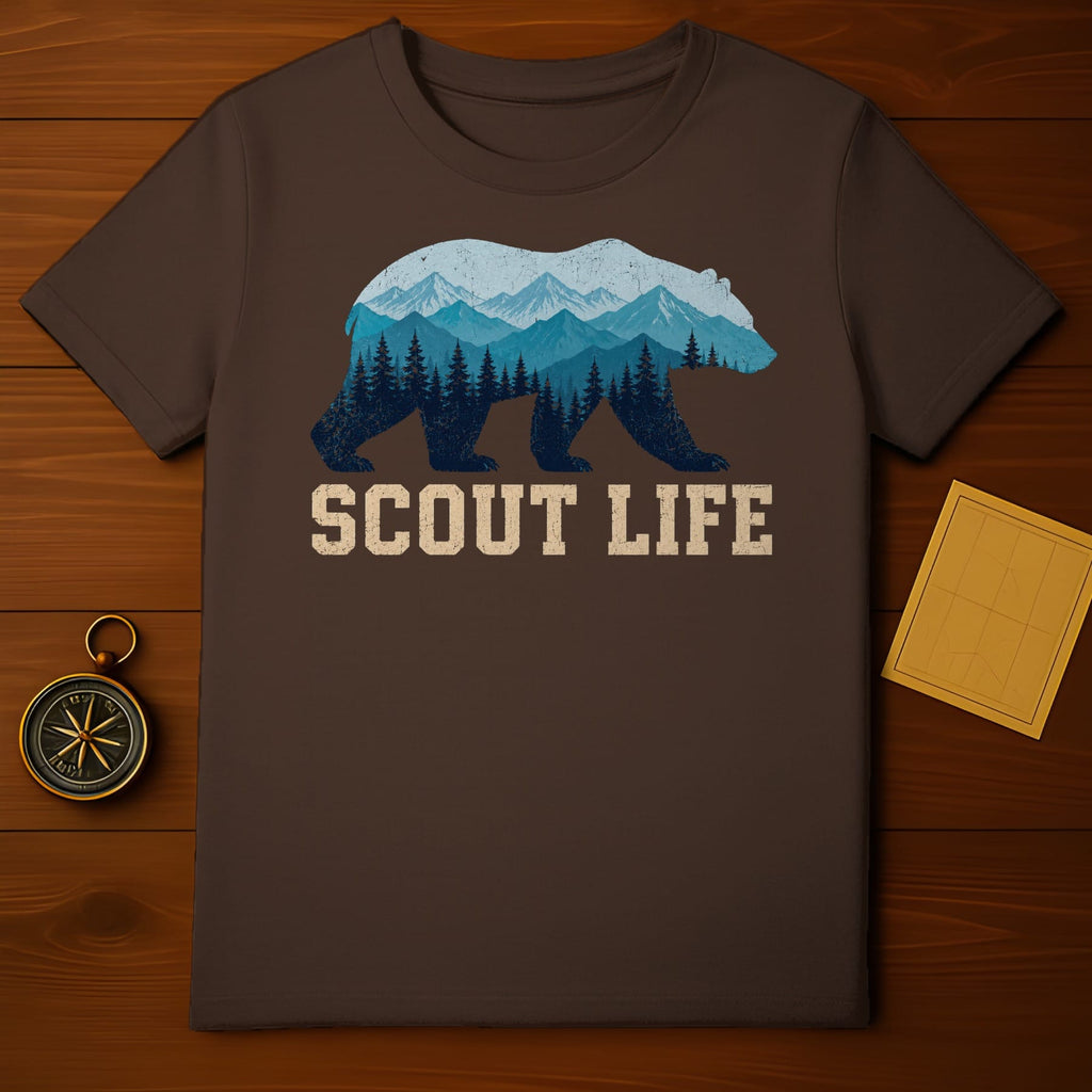 Brown t-shirt with a bear graphic containing mountains and trees, and text "SCOUT LIFE".