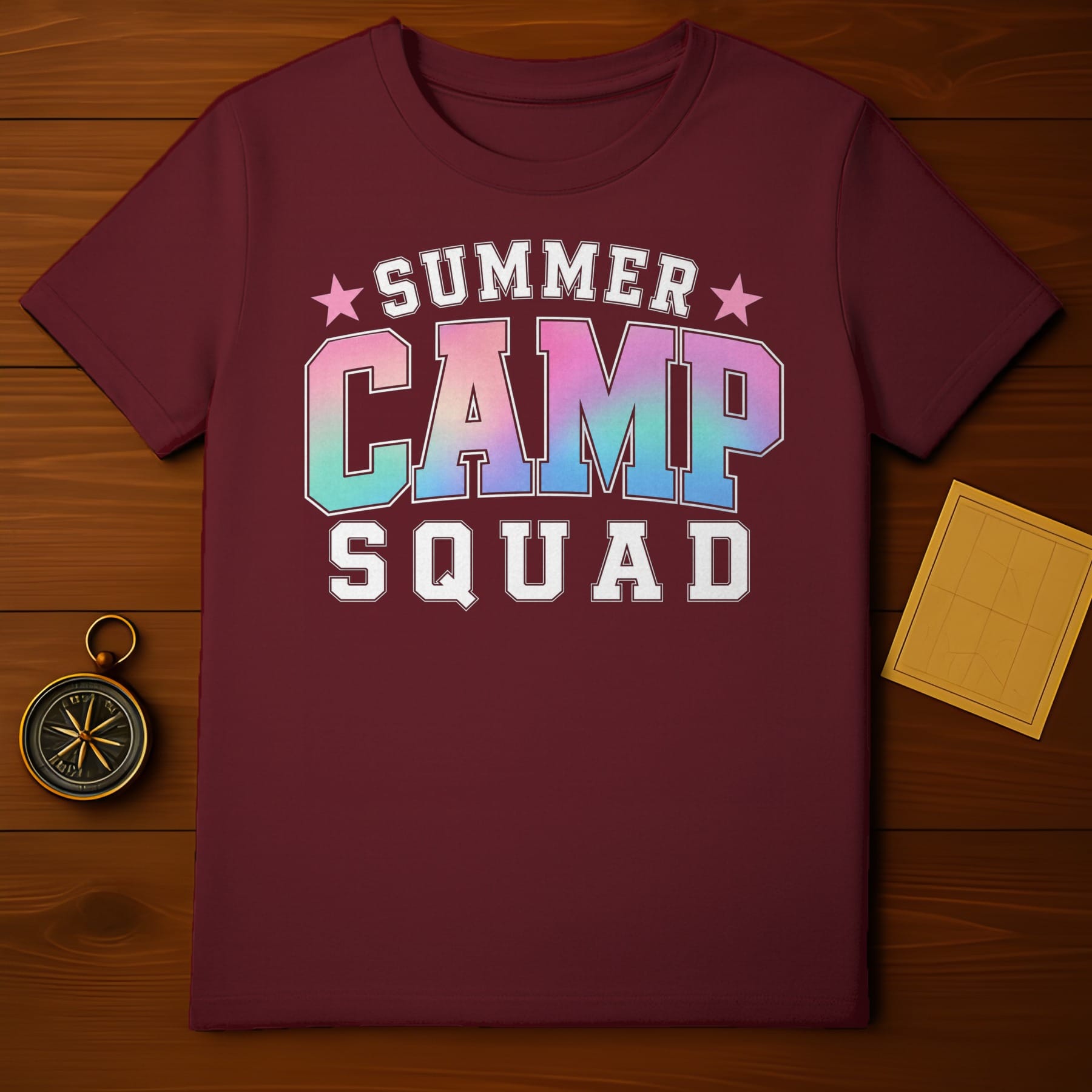 Maroon t-shirt with "Summer Camp Squad" text and iridescent lettering.